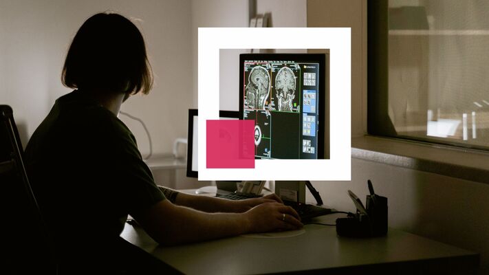 a female doctor works on semi-automatic segmentation of a brain MRI of a patient